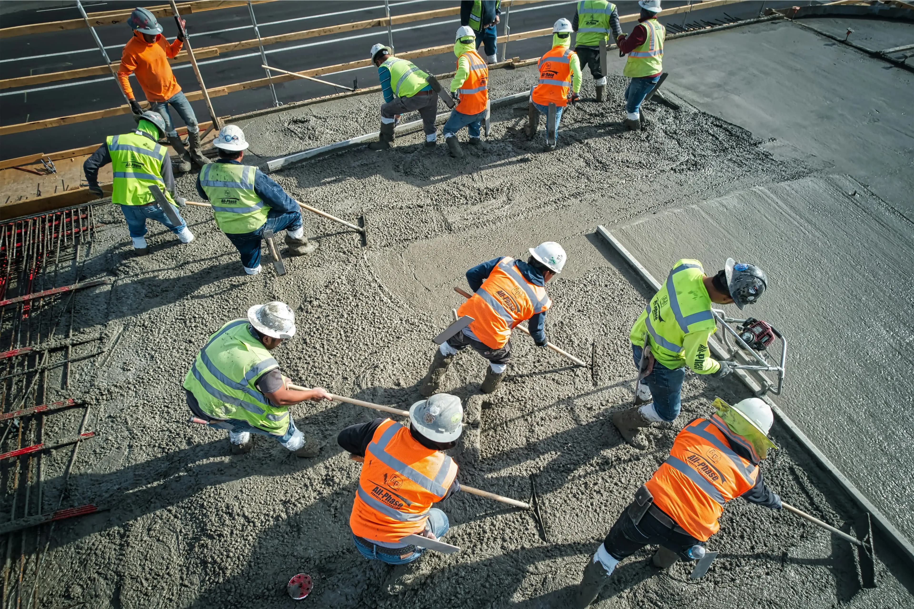 Construction crew reviewing plans on a job site